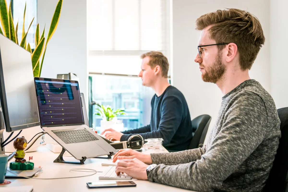 IT team working across multi-platform workstations